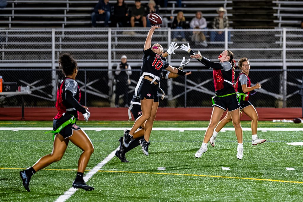Caravel freshman Kaylah McCraney makes a leaping effort to deflect the pass before it reaches Raider sophomore Hazel Harris.