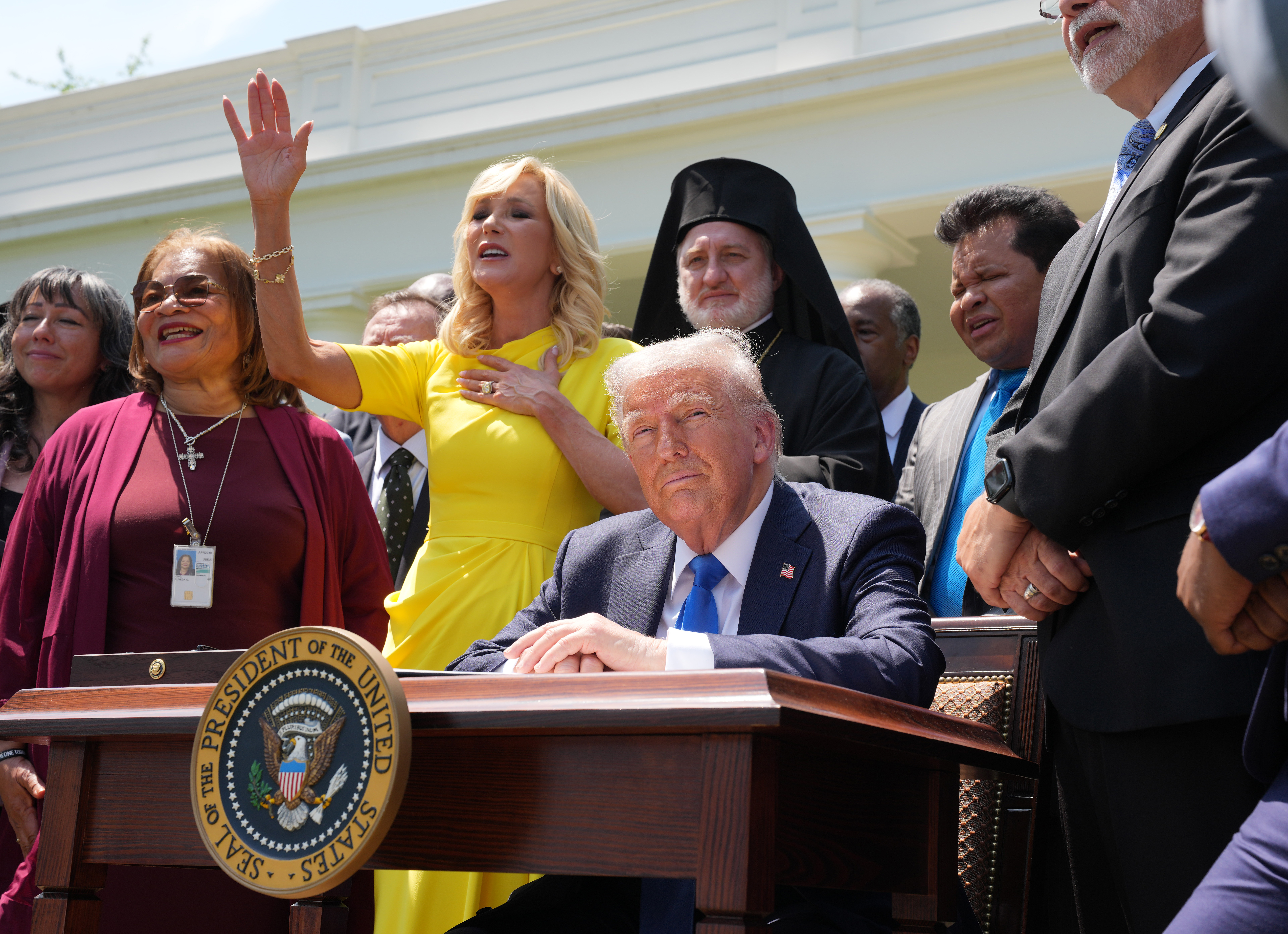 WASHINGTON, DC - MAY 01: Head of the White House Faith Office Paula White sings as she stands next to U.S. President Donald Trump and other religious leaders during a National Day of Prayer event in the Rose Garden at the White House on May 1, 2025 in Washington, DC. The National Day of Prayer is a congressionally recognized observance that calls on people of all faiths to participate in a day of prayer and reflection. (Photo by Andrew Harnik/Getty Images)