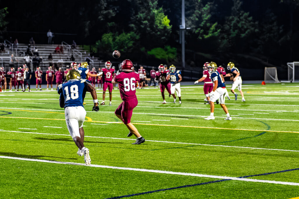 Salesianum senior Michael Brock breaks on the pass hoping to breakup the connection.