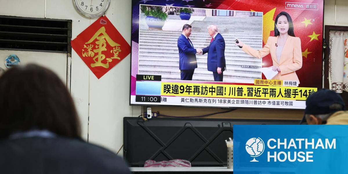 A television news programme at a restaurant in Taipei on 14 May 2026 shows the meeting between the US President Donald Trump and China's President Xi Jinping.