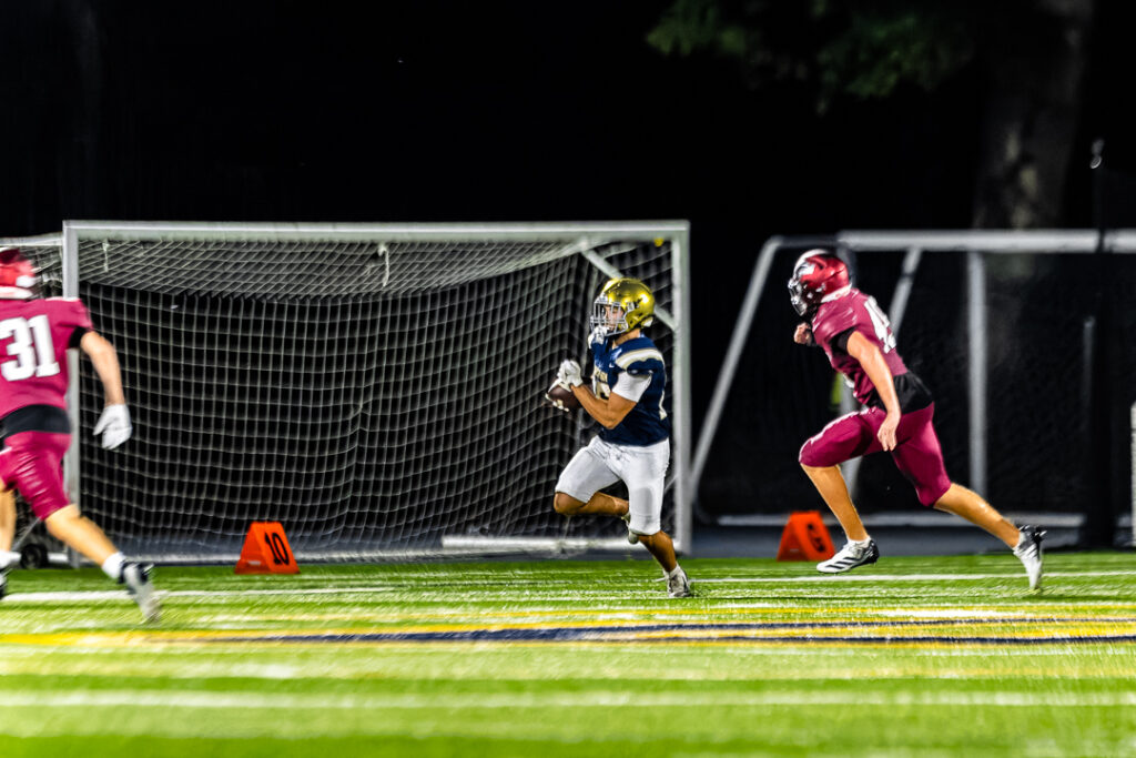A Salesianum player advances toward the first down marker. The Sals will start the regular season with a matchup against Springside Chestnut Hill Academy on September 3.