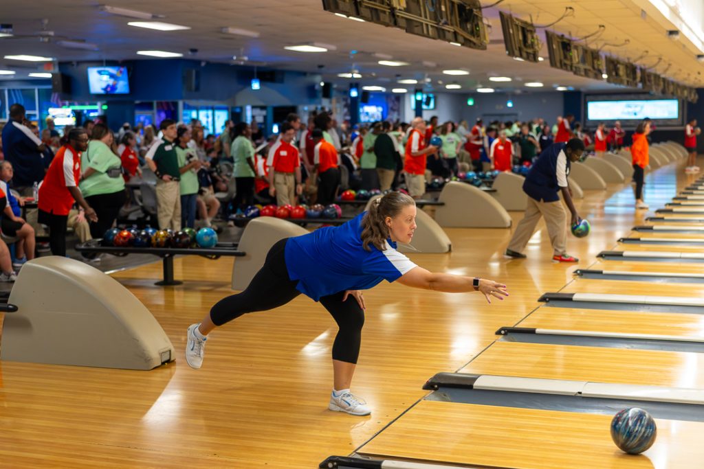 A member of the M.O.T. Tigers focuses on her bowl rolling down the lane.