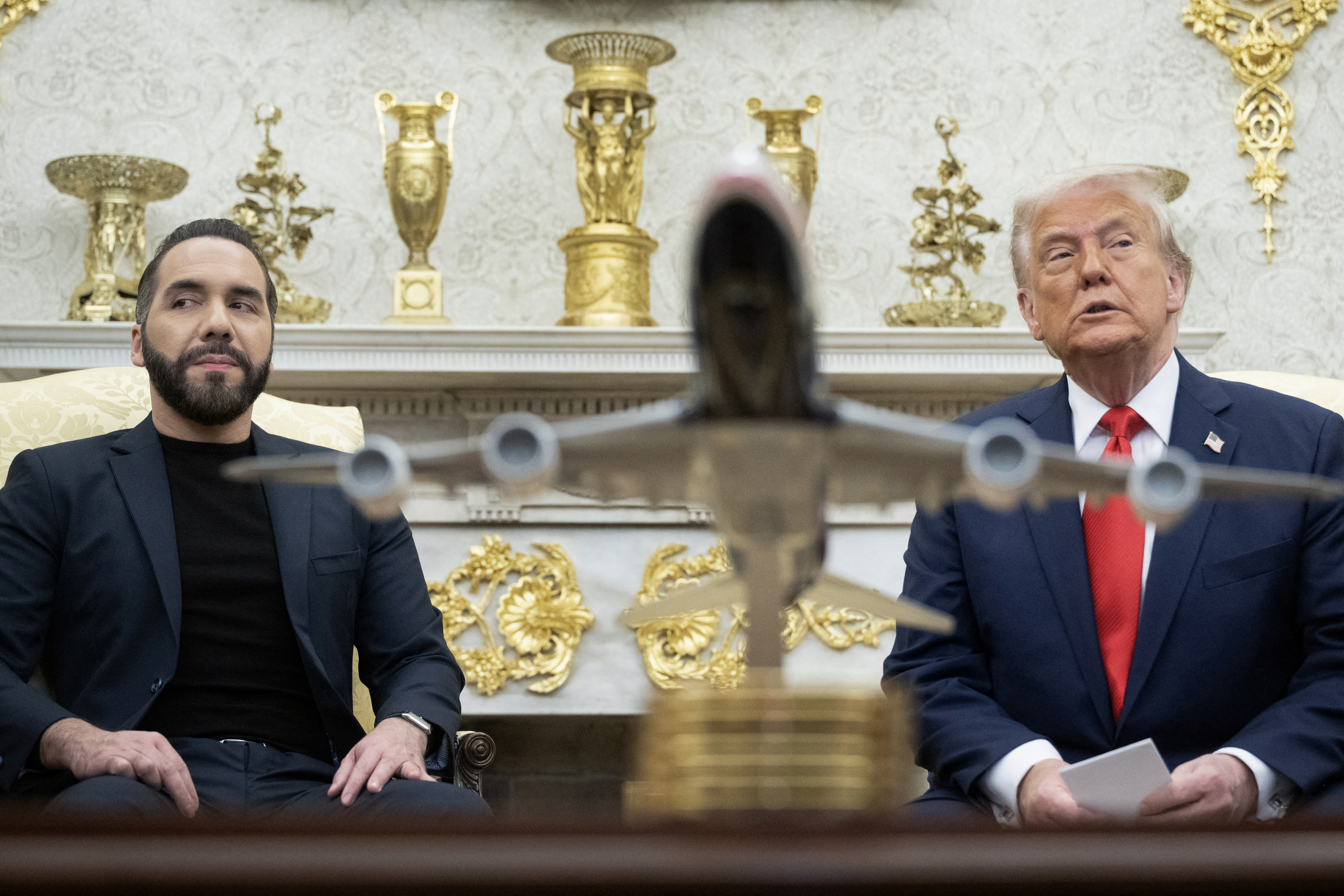 US President Donald Trump participates in a bilateral meeting with El Salvador's President Nayib Bukele in the Oval Office of the WHite House in Washington, DC, APril 14, 2025. Trump on Monday hosted El Salvador's President Nayib Bukele, the self-described "world's coolest dictator" who is now the US leader's key ally in a controversial push to deport illegal migrants to a notorious Salvadoran prison. The meeting comes as the White House faces pressure over the case of a father who was mistakenly deported to the jail in the Central American country -- whose return a US court has ordered the Trump adminstration to facilitate (Photo by Brendan Smialowski / AFP) (Photo by BRENDAN SMIALOWSKI/AFP via Getty Images)
