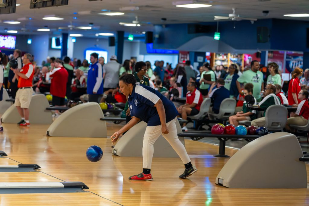 A member of the Kent Wildcats team releases their ball in hopes of a scoring a strike.