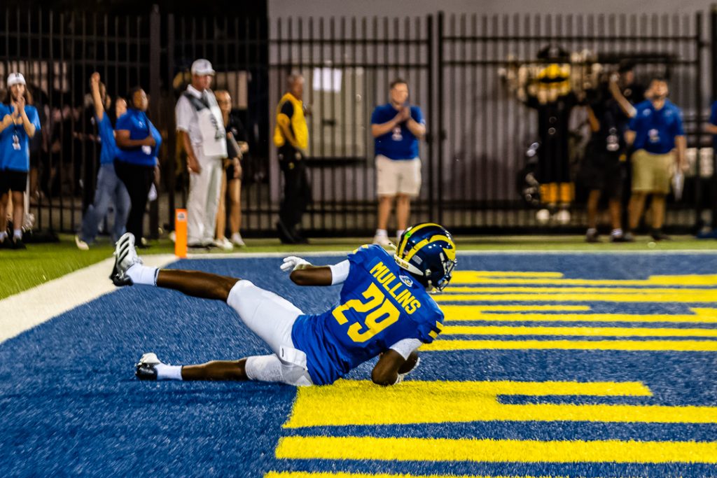 Sophomore safety George Mullins sliding in the endzone following his first career interception. Photo Credit: Dave Reeder. 