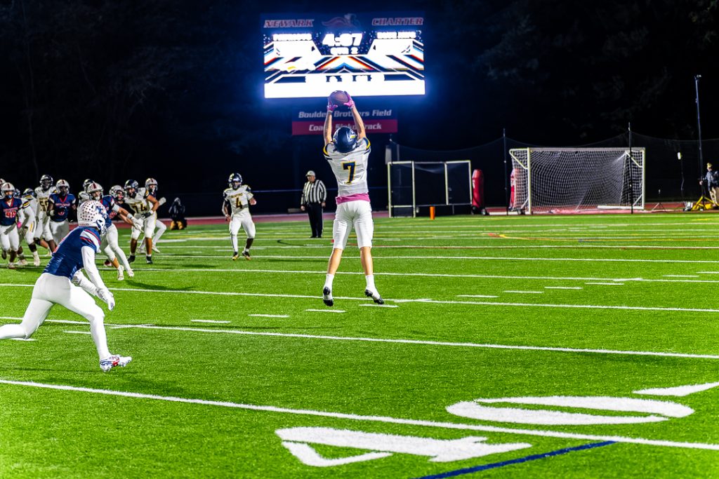 Blue Jay senior Jahari Ross leaps into the air to bring in the 10-yard catch.