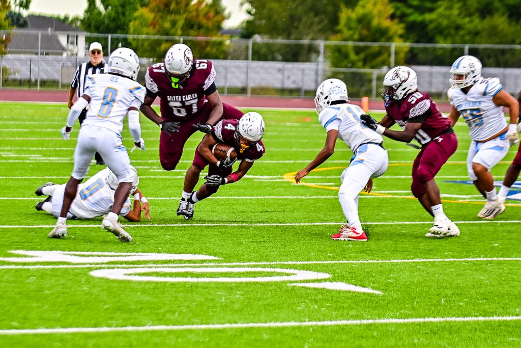 Hodgson senior Keytwan Sabur runs the ball for the Silver Eagles. Sabur scored Hodgson's first two touchdowns. Photo Credit: Dave Reeder.