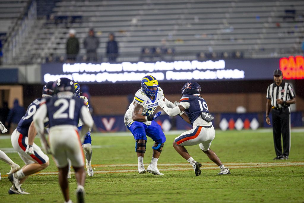 Roman blocks against Virginia defensive end Evan Ward during the Blue Hens' road game against the Cavaliers. Photo Credit: University of Delaware Football.
