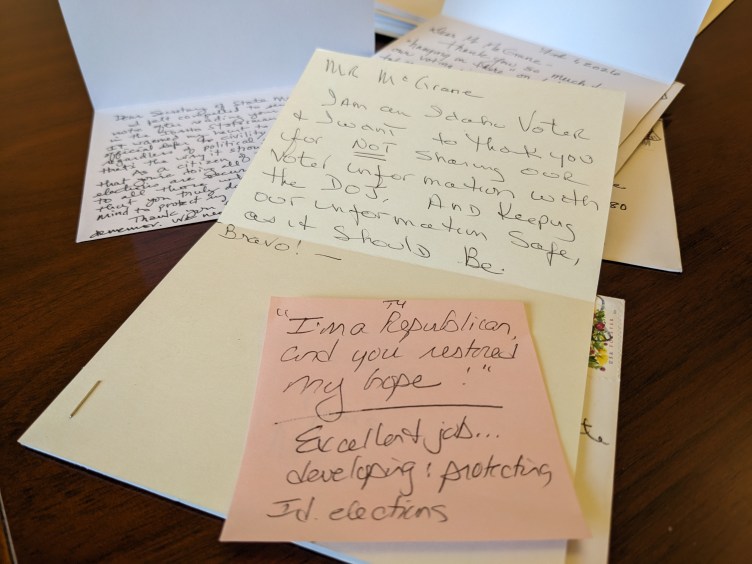 A pile of handwritten cards. A post-it note reads: “I’m a Republican, and you restored my hope. Excellent job…developing and protecting Id. elections.” Another card reads: “Mr. McGrane: I am an Idaho Voter and I want to thank you for NOT sharing our voter information with the DOJ. And keeping our information Safe, as it should be. Bravo!”