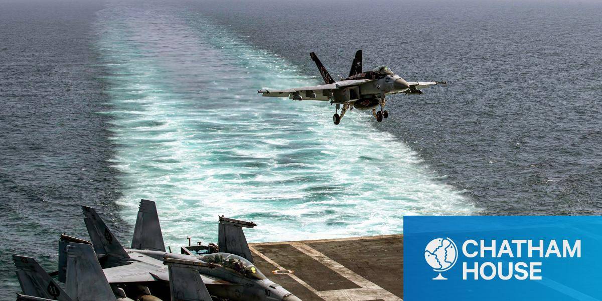 An F/A-18E Super Hornet, attached to Strike Fighter Squadron (VFA) 14, makes an arrested landing on the flight deck of Nimitz-class aircraft carrier USS Abraham Lincoln
