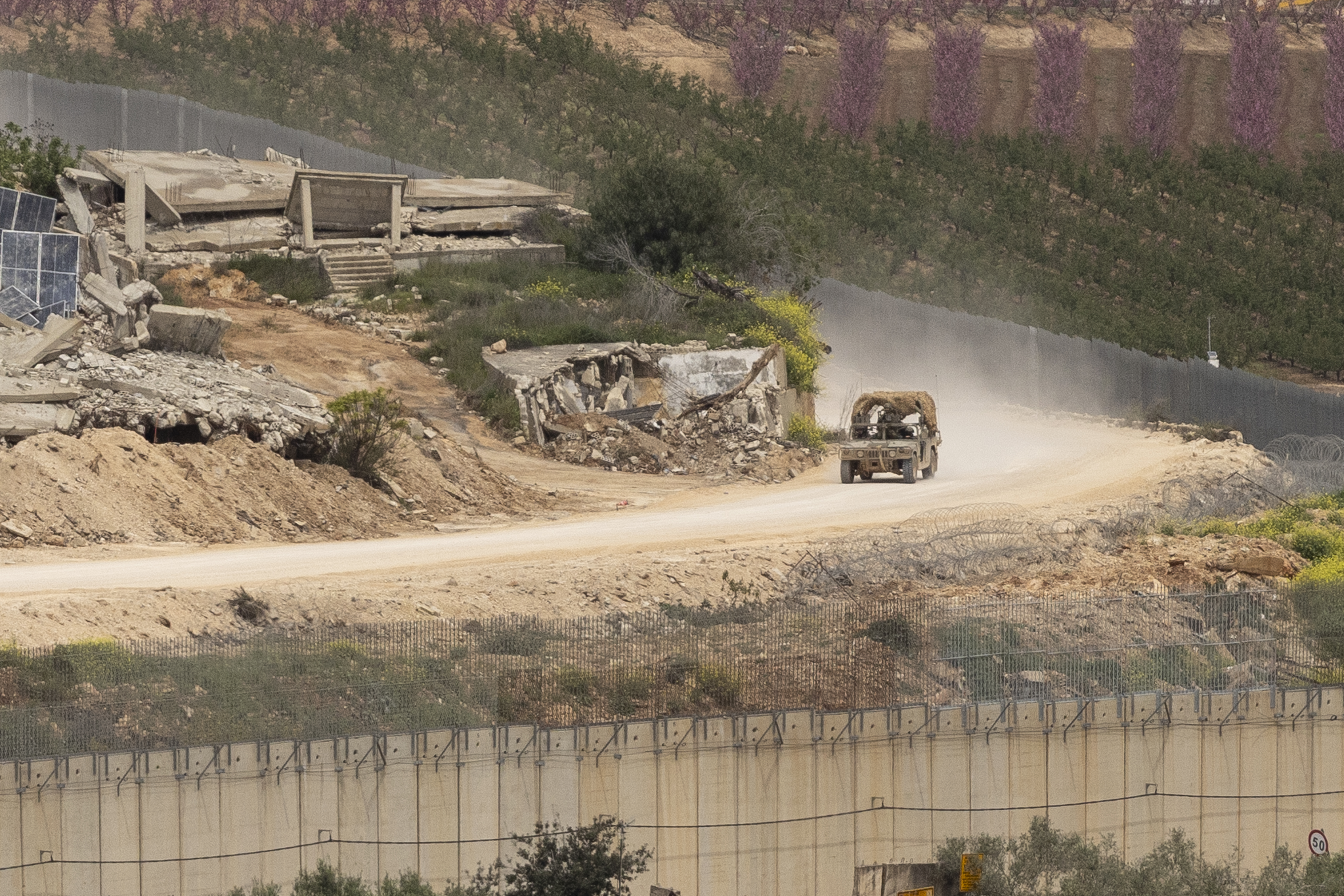 NORTHERN ISRAEL, ISRAEL, - APRIL 15: Israeli army vehicle move near destroyed houses in Southern Lebanon, as seen from a position on the Israeli side of the border on April 15, 2026 in Northern Israel, Israel. Israel and Lebanon's ambassadors have held historic talks in Washington, the first direct diplomatic meeting between the two sides in decades. During the two-week ceasefire period between the US and Iran, Israel and the Iran-backed militant group, Hezbollah, have continued fighting. On April 8 Israel intensified strikes on what it says were Hezbollah targets, killing more than 350 people, according to health officials in Lebanon. (Photo by Amir Levy/Getty Images)