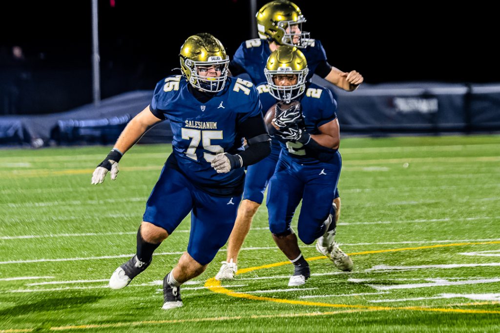 Sallies junior EJ Cotton follows senior Christian Hudson on a run near the end of the first half.
