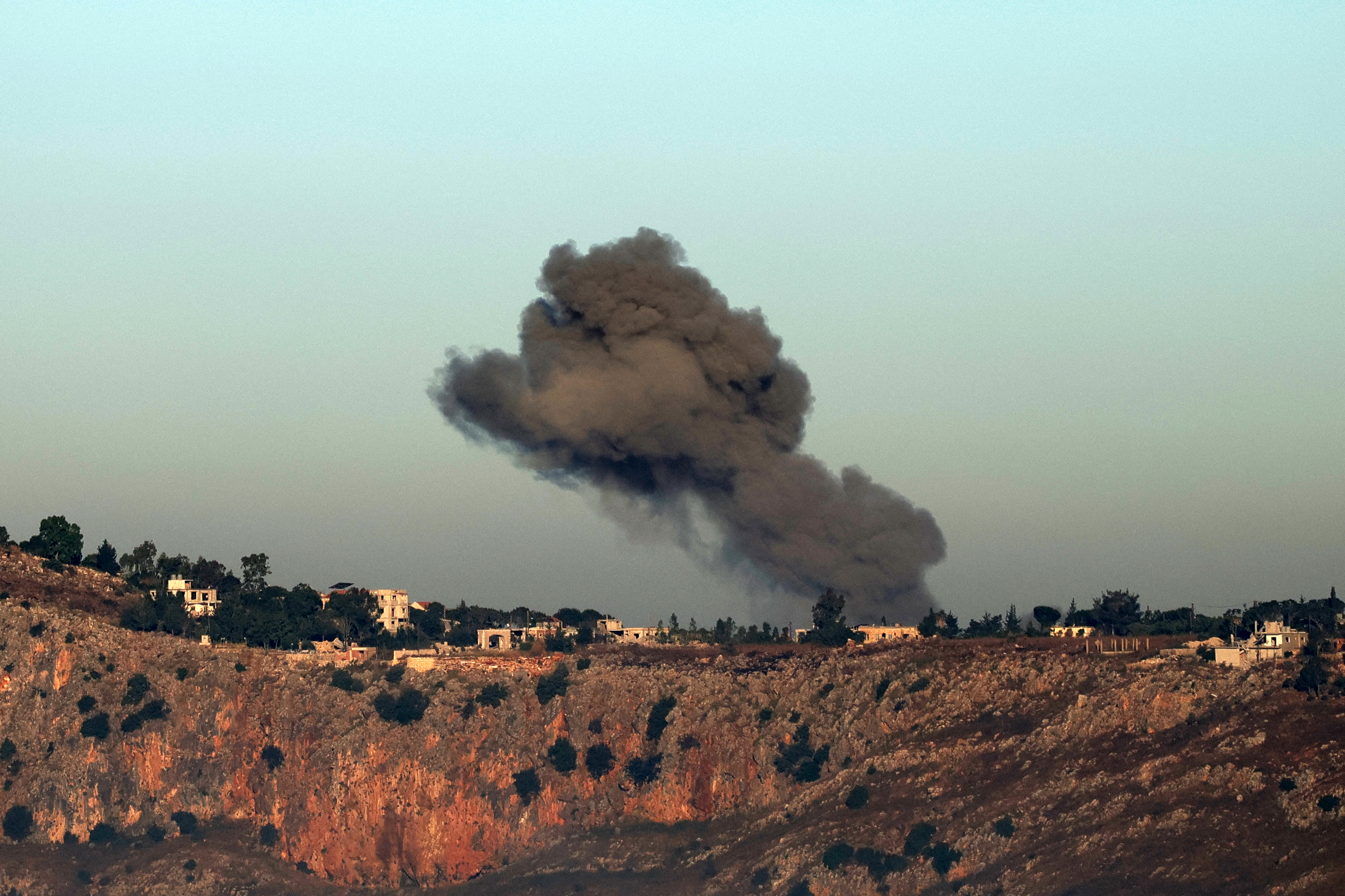 TOPSHOT - This photograph taken from the southern Lebanese area of Marjayoun shows smoke rising from the site of an Israeli strike that targeted the village of Arnoun on June 3, 2026. Lebanon's army said two personnel were wounded when an Israeli strike hit a military vehicle in the country's south on June 3, as Israel pounds the region in its ongoing war against Hezbollah. (Photo by AFP via Getty Images)