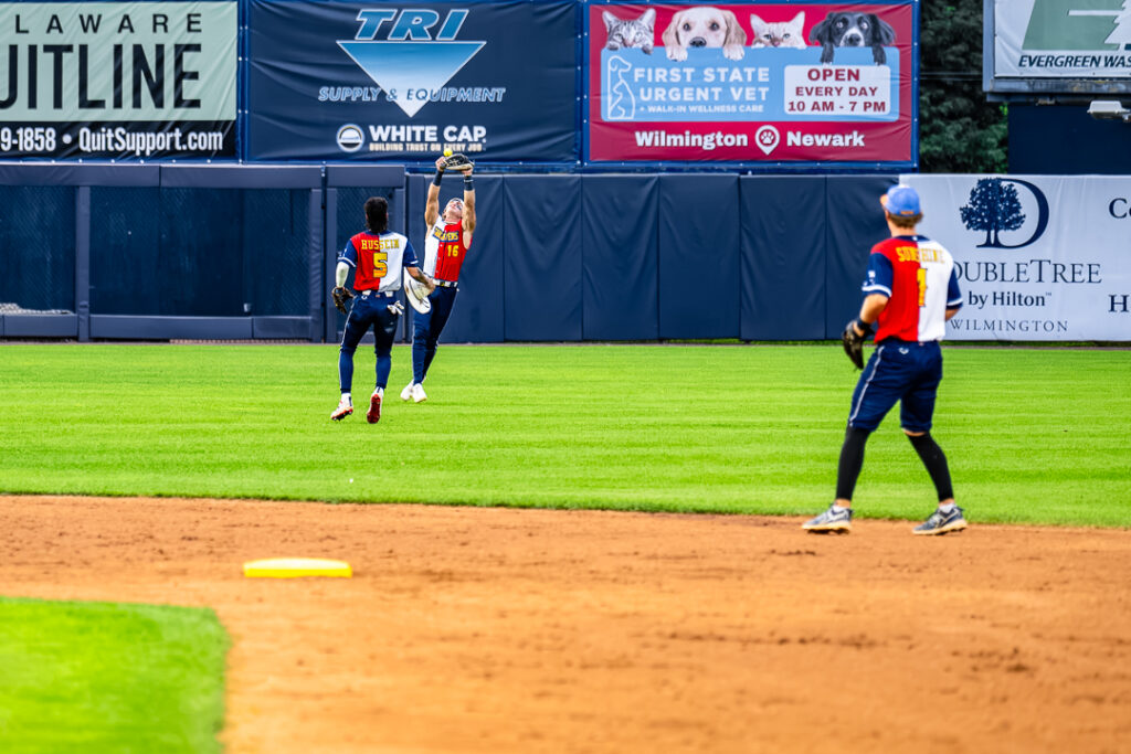 Tailgater left fielder Travis Moniot (No. 16) bumps the ball into the air to intiate a trick play out between him and Jordan Hussein (No. 5). 