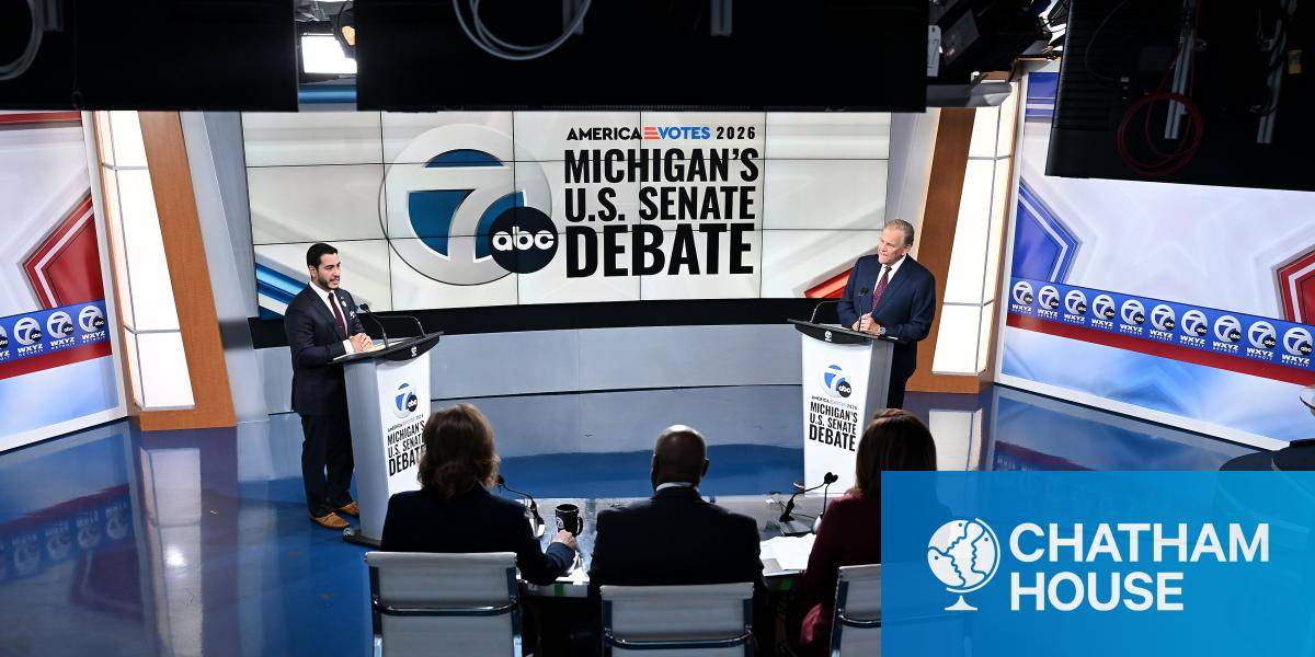 Senate candidates Democrat Abdul El-Sayed, left, and Republican former US Rep. Mike Rogers in a TV studio for the midterms debate