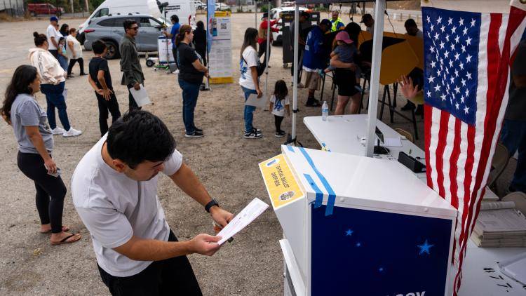 a man casts a ballot in the 2024 US presidential elections