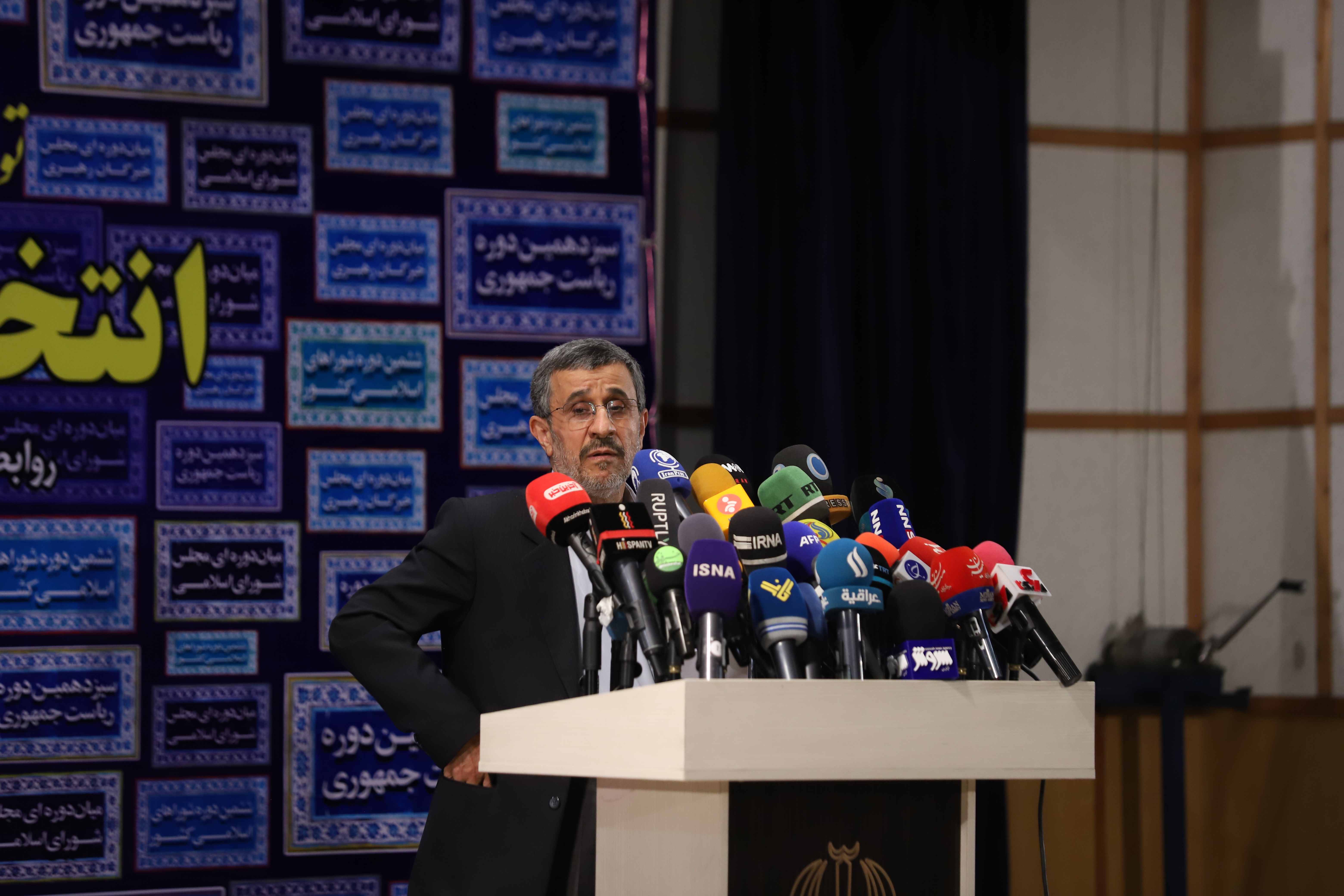 TEHRAN, IRAN - MAY 12:  Iran's former president Mahmoud Ahmadinejad reads his statement while attending a press center after registering as a candidate for June 18, presidential elections, in the Iranian Interior Ministry building on May 12, 2021 in Tehran, Iran. (Photo by Majid Saeedi/Getty Images)