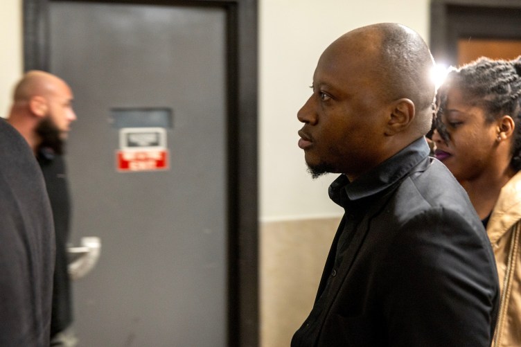 A side view of a man walking through a government building.