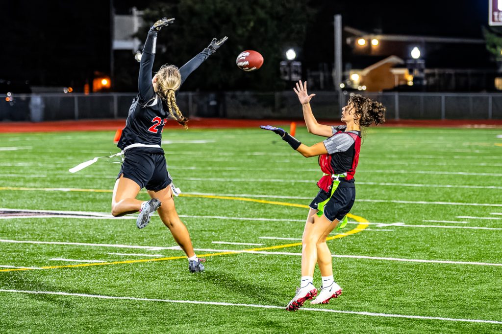 Loyola looks in a pass from Godfrey and scores a Raider touchdown.