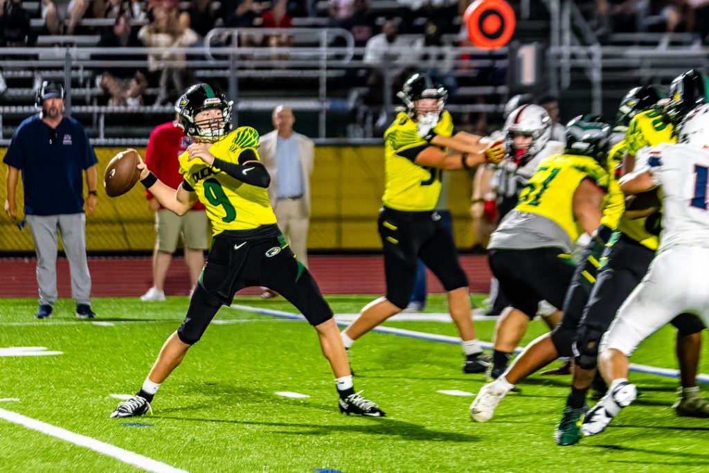 Odessa quarterback Nicklas Bateman loads up for a deep pass downfield.