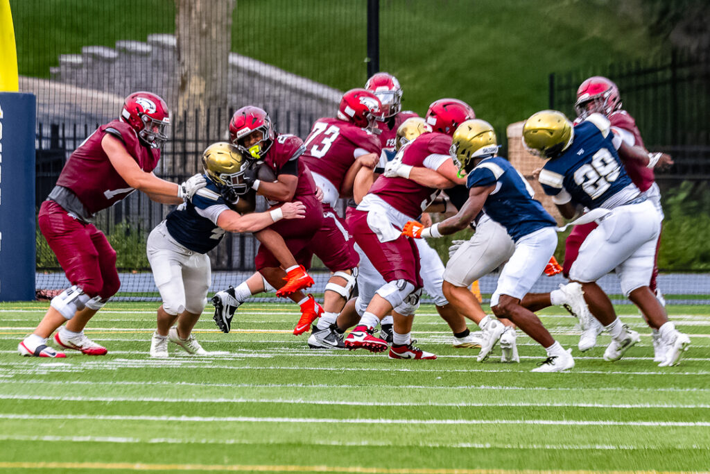 A Salesianum player makes the tackle, stopping the St. Joseph run play.