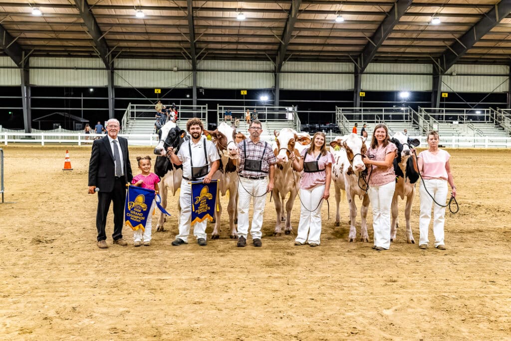 The winners of the Best Three Females Holstein cows pose for a picture after the Open Dairy Cattle Show.