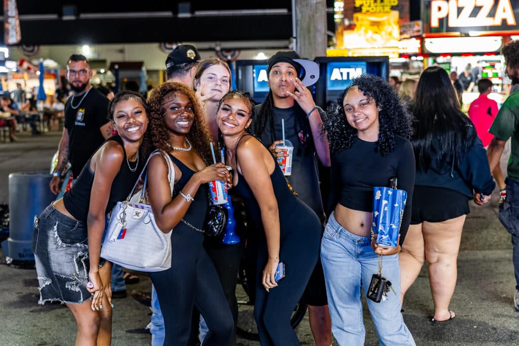 Fairgoers stop for a picture as they enjoy some refreshments.
