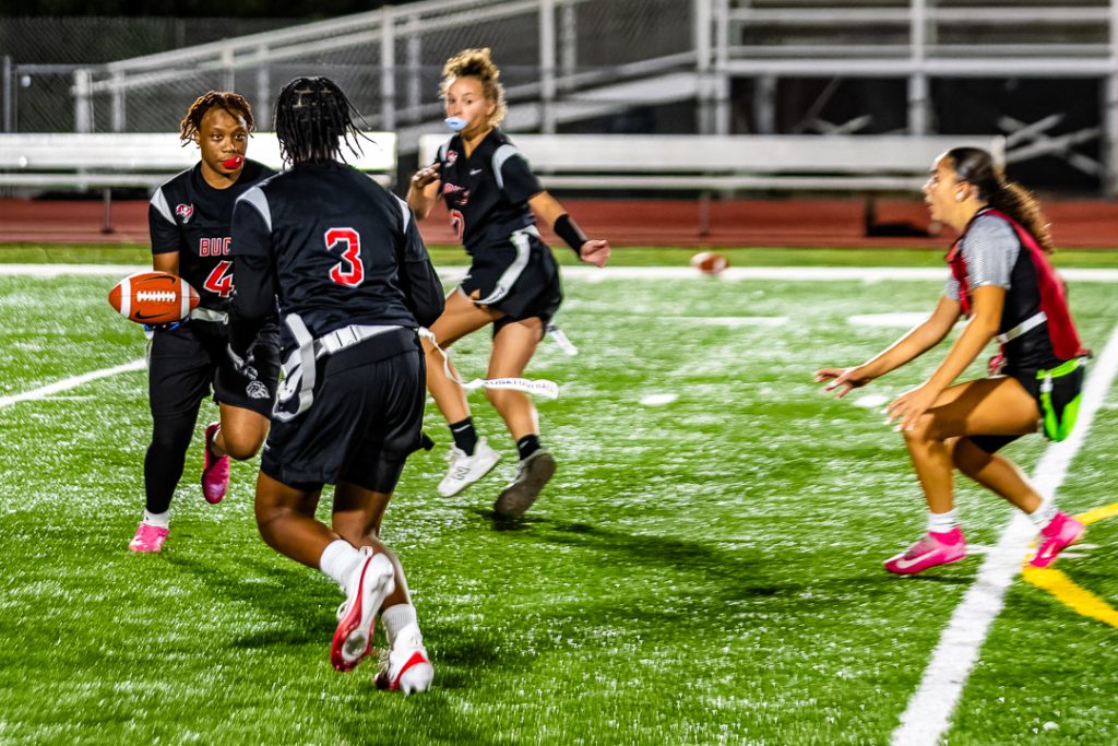 Buccaneer sophomore Armonee Minter-Caulk gives the double handoff to Sudler running the reverse.