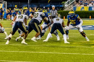 Blue Hen offensive lineman Wahkeem Roman (65) gets ready to block during his first game as a Blue Hen. Photo Credit: Dave Reeder