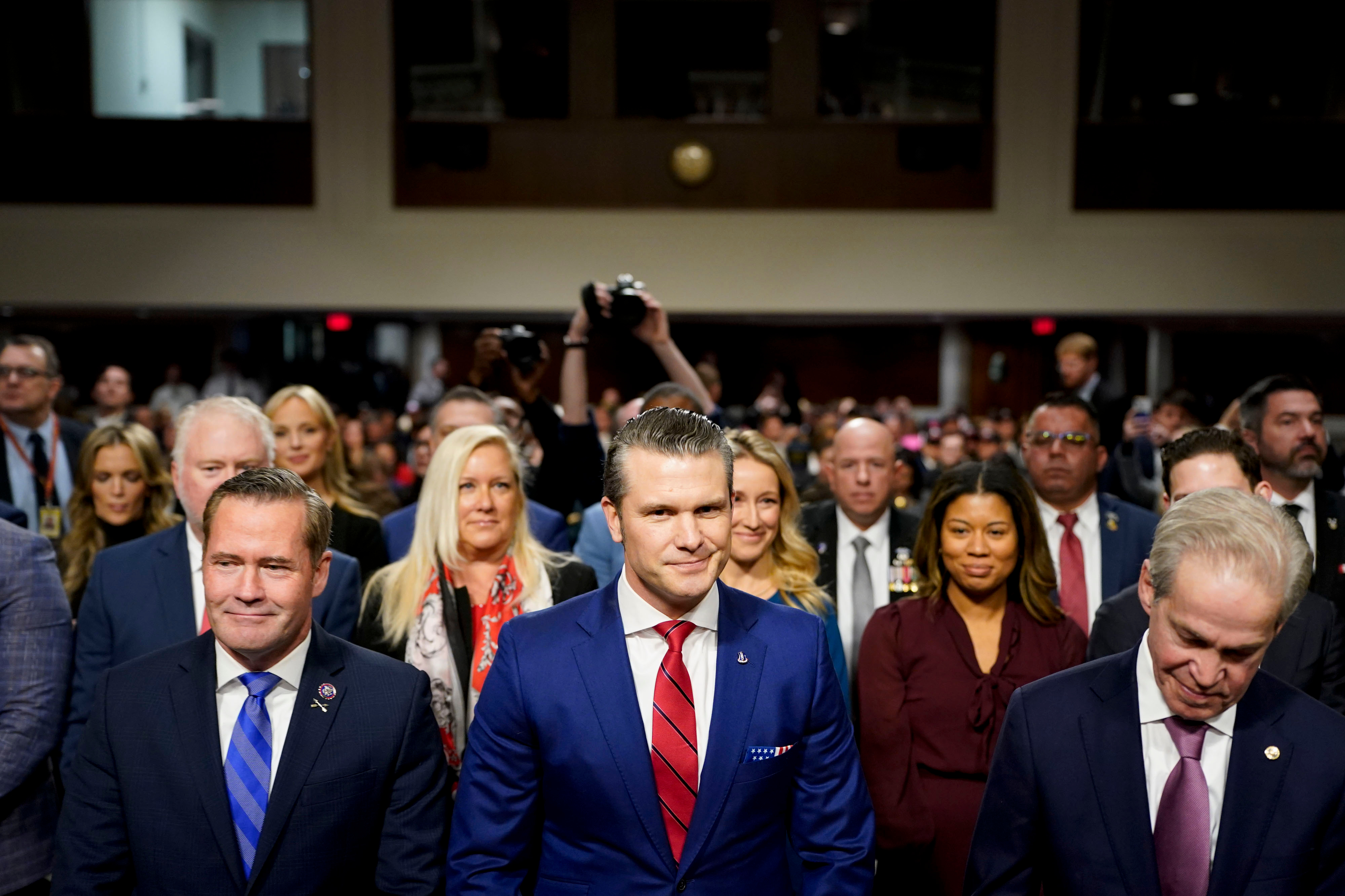 Pete Hegseth, military analyst at Twenty-First Century Fox Inc. and US secretary of defense nominee for US President-elect Donald Trump, center, arrives for a Senate Armed Services Committee confirmation hearing in Washington, DC, US, on Tuesday, Jan. 14, 2025. Hegseth is portraying his lack of high-level management experience as an asset, saying in prepared testimony for his confirmation hearing that he'd be a "change agent" with no vested interest in certain companies or specific programs or approved narratives. Photographer: Kent Nishimura/Bloomberg via Getty Images