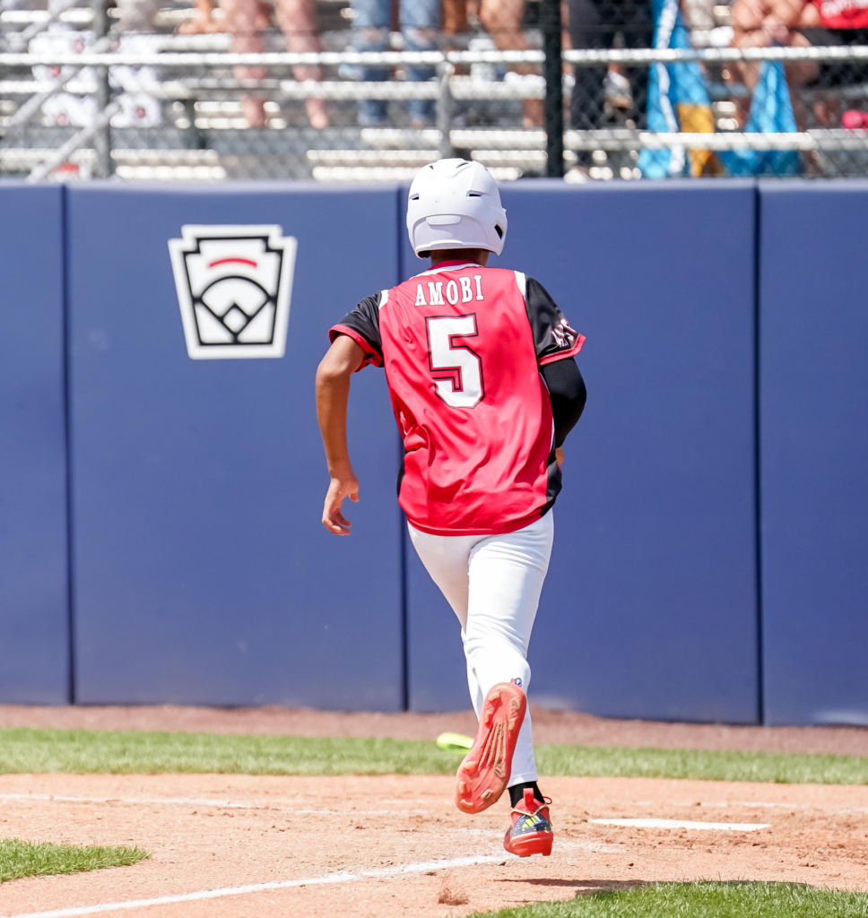 Delaware third baseman Taj Amobi scores one of Delaware's 11 runs in the top of the fifth. Photo Courtesy of No. 10 Charles Puit at bat during Naamans Little League's game against Berlin Little League from Maryland. Photo Courtesy of Little League Baseball and Softball.