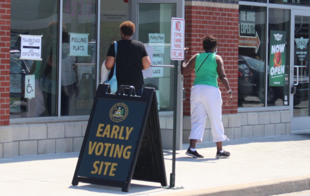 Voters walk into an early voting center in the Christina Crossing shopping center in Wilmington, Delaware, on Aug. 29, 2024.