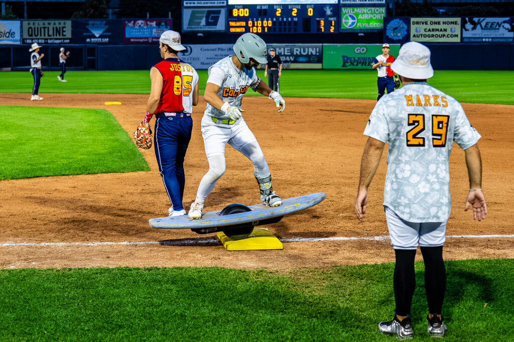 Coconut Kaden Bowler glides to first on a hoverboard designed to look like a surfboard. Photo Credit: Dave Reeder.