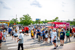 Fans enter the plaza before the gates to the stadium officially open for the game.