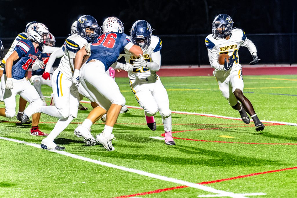 Seaford sophomore Nasir Serpa looks for running room as the Blue Jays drive down the field in the second quarter.