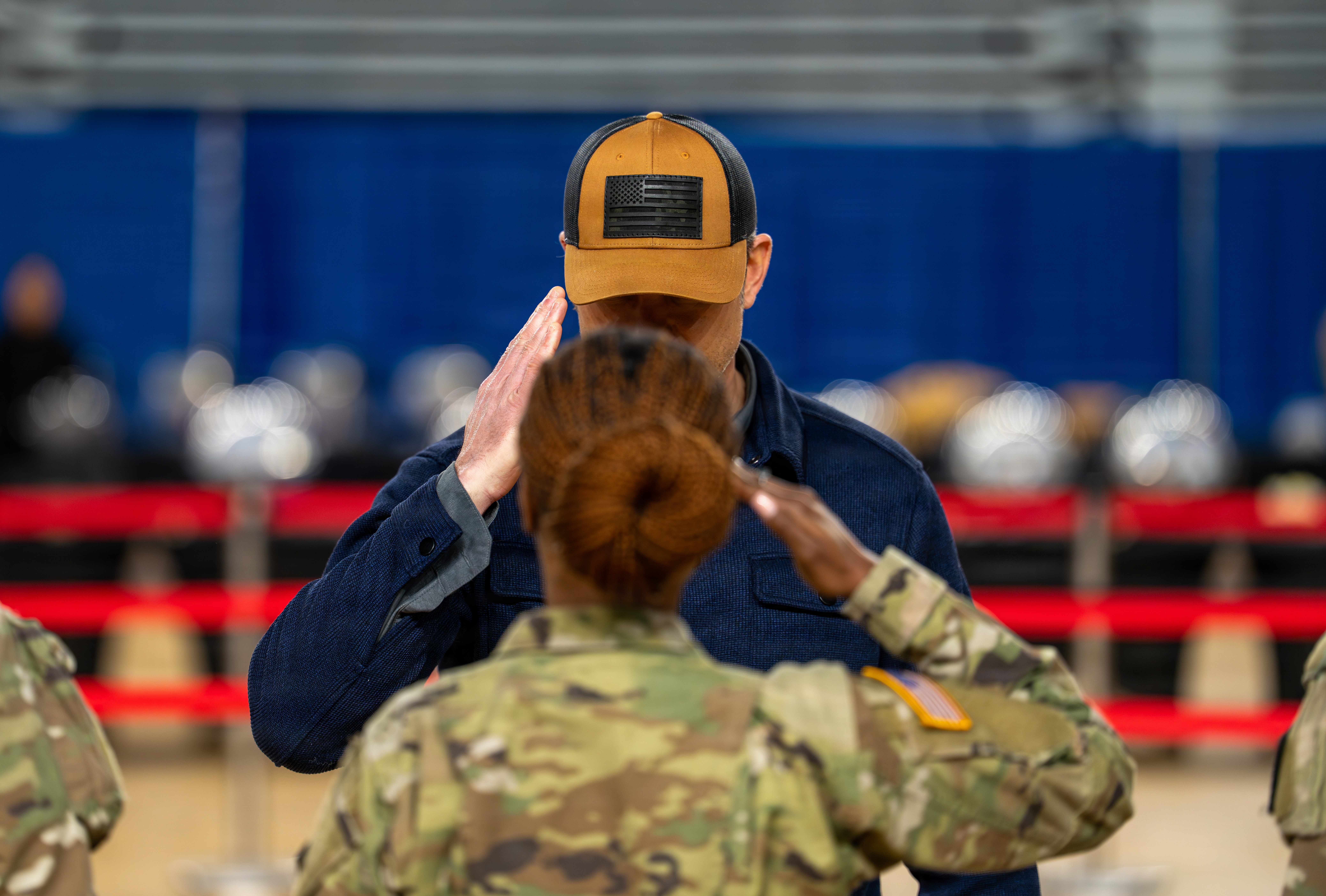 Secretary of War Pete Hegseth and his wife, Jennifer, share a moment while serving Thanksgiving meals to service members supporting Joint Task Force–District of Columbia in Washington, D.C., Nov. 28, 2025. Leaders, families, and volunteers came together to honor troops working through the holiday. (U.S. Air Force photo by Master Sgt. William Blankenship)