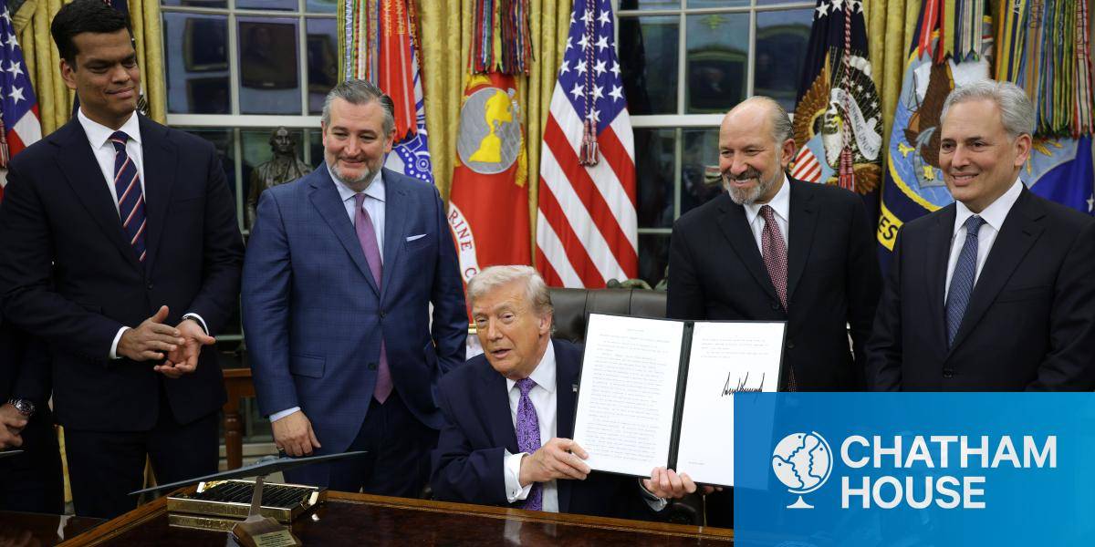 US president Donald Trump displays a signed executive order on AI