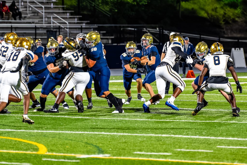 Sallies senior Liam Sherlock finds an opening to run through against the Explorer defense.