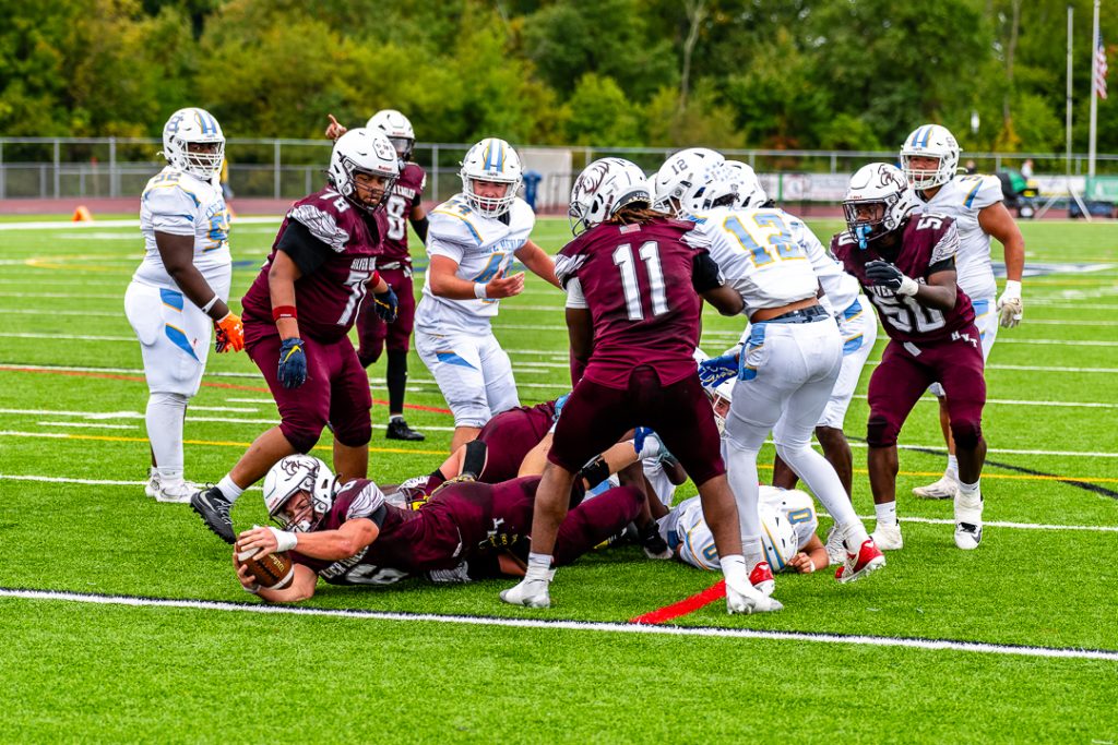 Yancey is brought down by the Viking defense just before the goal line.