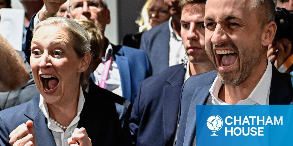 AfD's main candidate in the Saxony-Anhalt state election, Ulrich Siegmund, and the co-leader of the far-right Alternative for Germany (AfD) party Alice Weidel celebrate, a crowd behind them