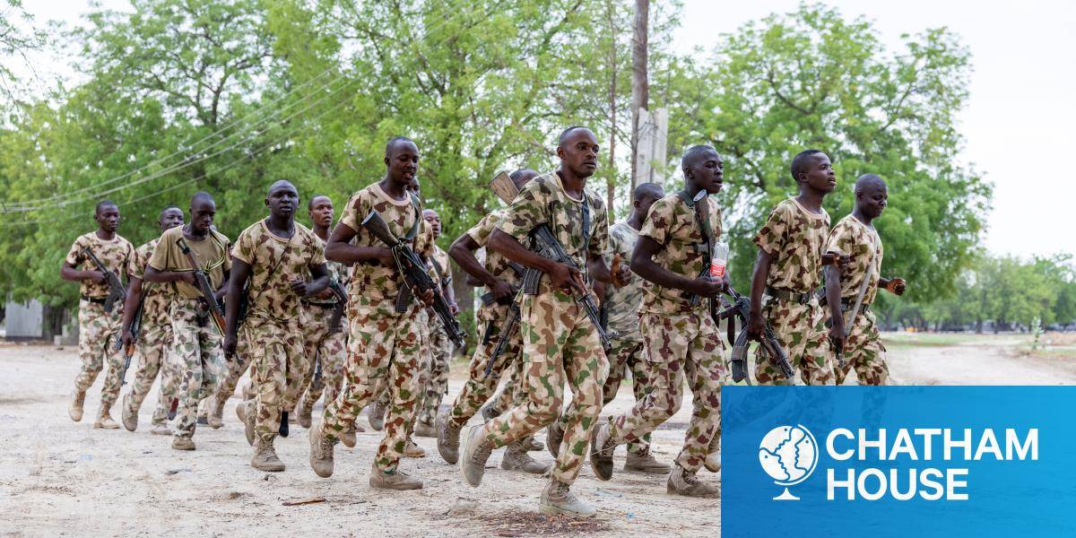Nigerian soldiers from the Multinational Joint Task Force (MNJTF) run while singing during training.