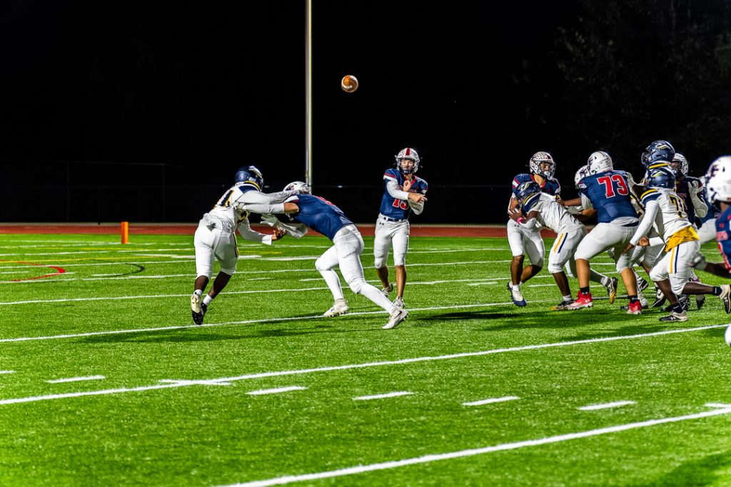 Patriot quarterback Chase Kennedy throws a pass out wide during Newark Charter's first possession of the second half. 