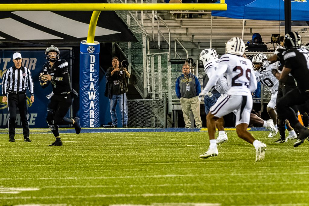Minicucci rolls out to his right looking for a receiver downfield. Photo Credit: Dave Reeder