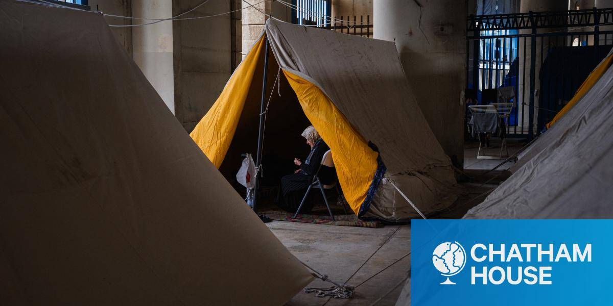a woman sheltering in a tent