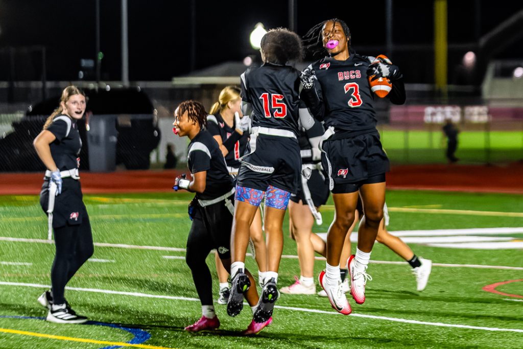 Sudler celebrates scoring her second touchdown of the game with sophomore Jay'Brianna Boyd (15).