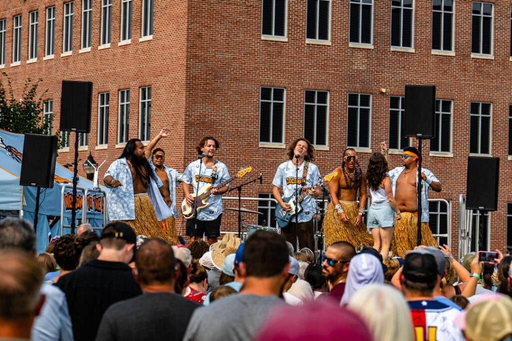 The Hulagans share the stage with the Coconuts' traveling band "Sitting on Saturn" during the Loco Beach Live Show during the pregame festivities. 
