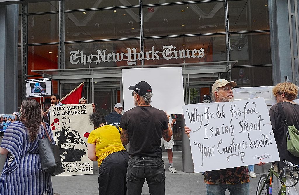 NEW YORK, UNITED STATES - AUGUST 10: Protesters holding banners and Palestinian flags march to Times Square after picketing The New York Times to demand justice for Palestinian journalist Anas Al-Sharif and all journalists killed in Gaza by Israel, on August 10, 2026, in New York City, United States. (Photo by Selcuk Acar/Anadolu via Getty Images)