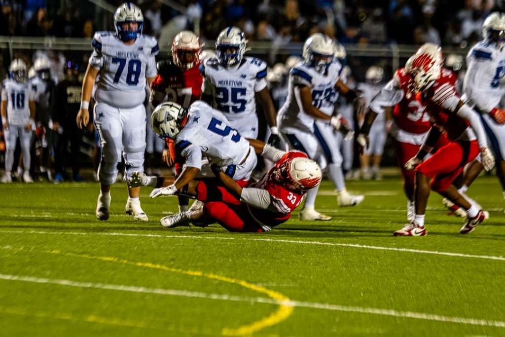 Middletown senior, Hanif Miller, is brought down by Smyrna defensive lineman, Wendell Smallwood.