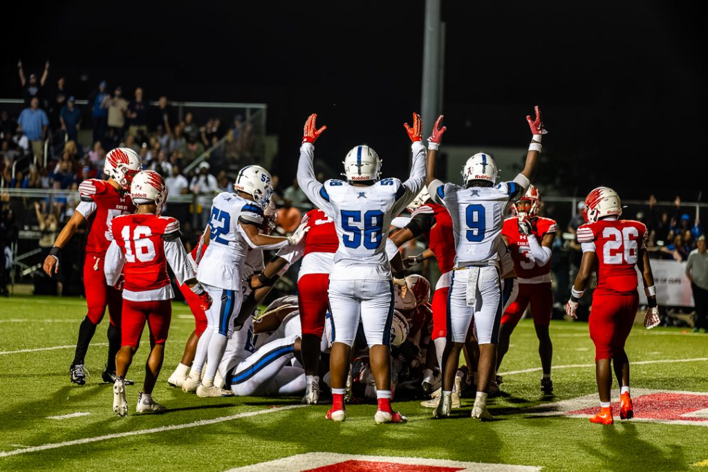 Middletown players signal for a touchdown after their teammate broke the goal line.