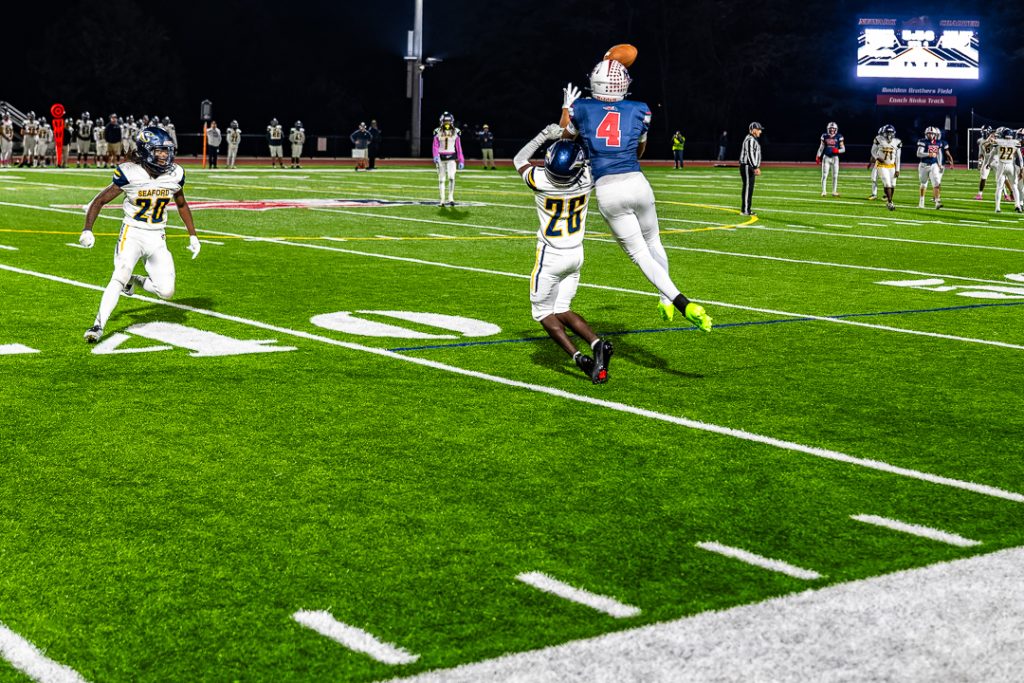 Newark Charter senior Cayden Anderson leaps over the defender to make the catch on the Patriots' final drive of the game. Newark Charter's final offensive possession in the fourth quarter consumed over six minutes of time.
